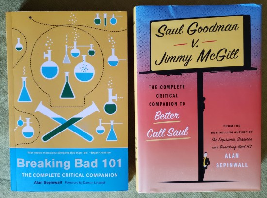 Each of the two books covered in this entry -- one with chemistry glassware all over it in a Jolly Roger shape, the other with a billboard silhouette and a tiny shyster standing at its base.