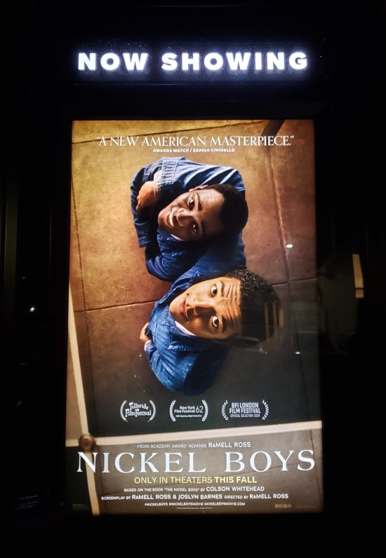 Nickel Boys poster with a reflection of our two stars looking up into a mirrored ceiling.