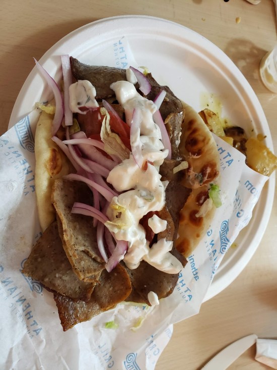 Large gyro that takes up half a 10-inch paper plate. It was served heavy on the red onions.