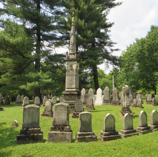 Several tombstones ringed around an obelisk. Many bear the last name Hunt.