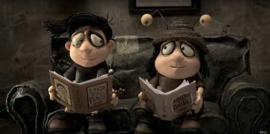 A brother and sister sit on a couch in a very brown house. He reads "Lord of the Flies" and has a black eye, she reads "Life Cycle of the Snail" and wears a snail hat.
