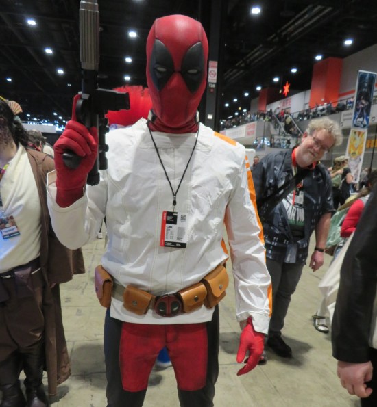 Deadpool cosplayer wearing a Narkina 5 jacket, white with orange sleeve stripes.