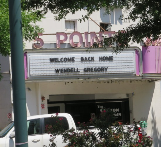 Theater marquee says "Welcome Back Home Wendell Gregory".