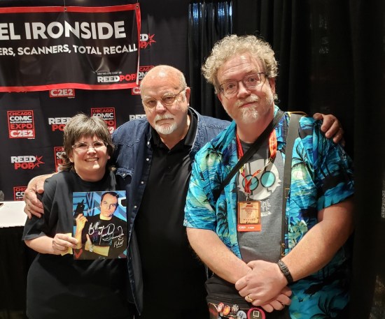Us posing politely with Michael Ironside at his table.