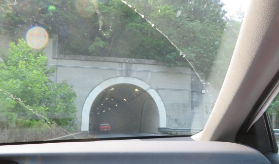 Entrance to a road tunnel through the base of an Appalachian mountain.