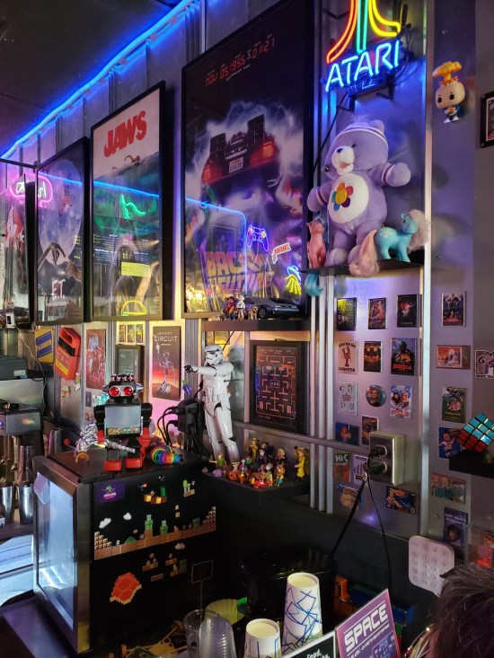 Wall of toys and movie posters and stuff.