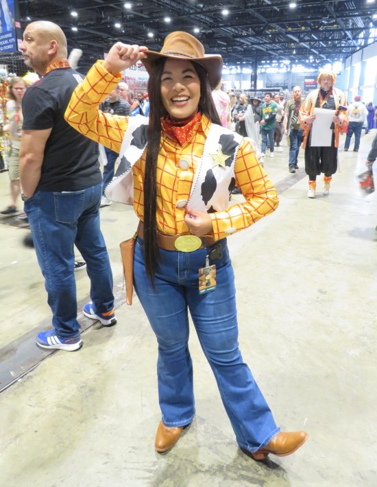 Smiling Sheriff Woody cosplayer.