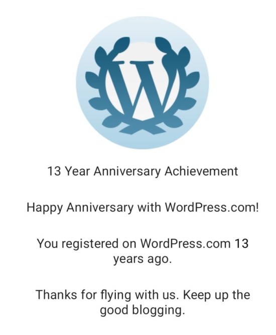Screen shot of WordPress logo with message, "13 Year Anniversary Achievement. Happy Anniversary with WordPress.com!" and so on.