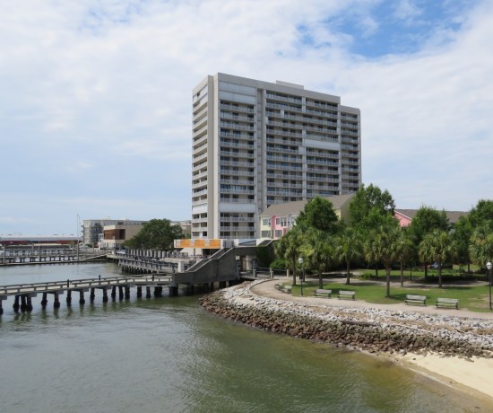 What looks like a fancy white 19-story seaside hotel and a park full of palmettos. Then, as the caption shows, I went down a research rabbit hole.