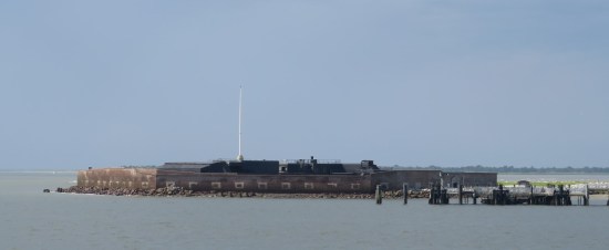 Fort Sumter on the horizon, empty flagpole visible in the middle.