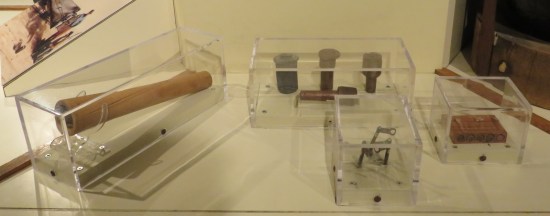 Collection of tiny parts of 1860s explosive devices.