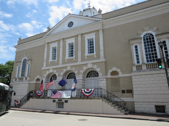 19th-century building turned into a museum. Three archways slightly above street level, plus a doorway at street level.