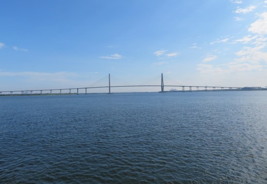 Distant shot of long bridge with two towers to which all support cables connect.