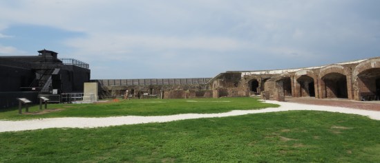 More of Fort Sumter's grass, lots of brick walls and structures at the other end.