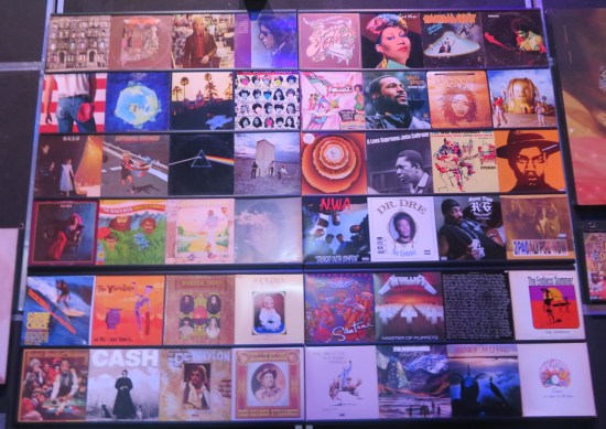Wall display of 48 different albums from different genres.