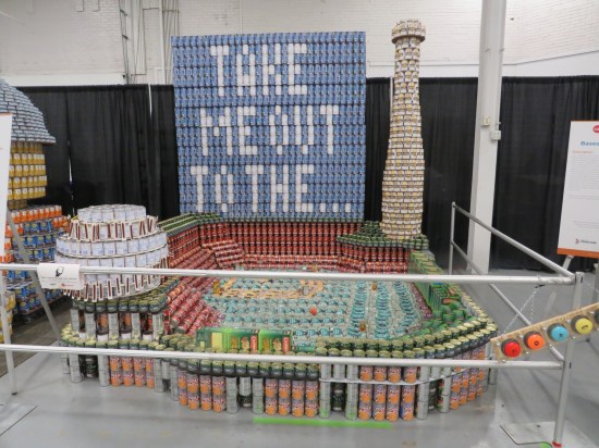 canned food sculpture of baseball stadium with Jumbtron message "Take Me Out to the..."