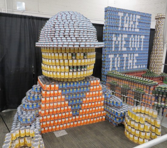 canned food sculpture of Lego construction worker.