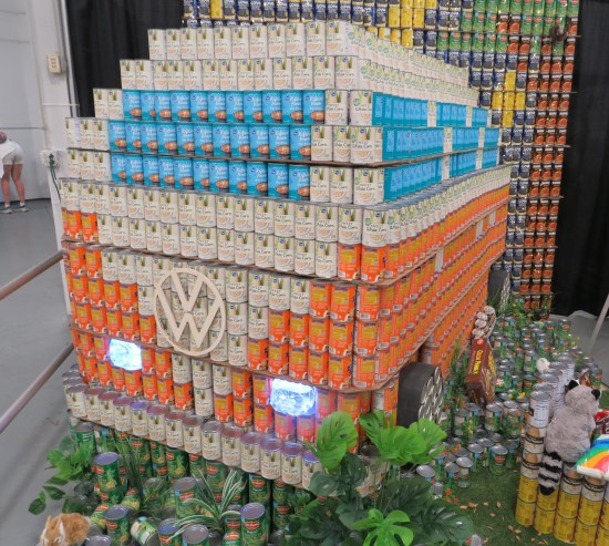 canned food sculpture of old orange and white Volkswagen van.