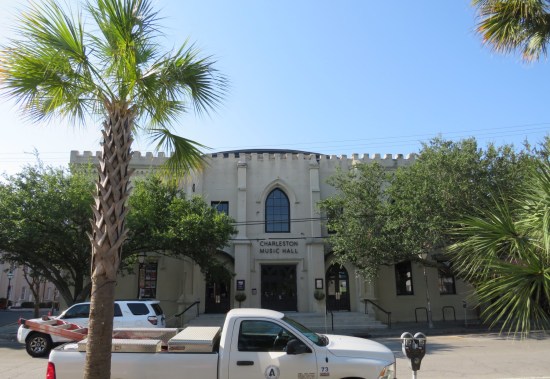 Charleston Music Hall looks like a refined two-story white castle with palmettos in front.