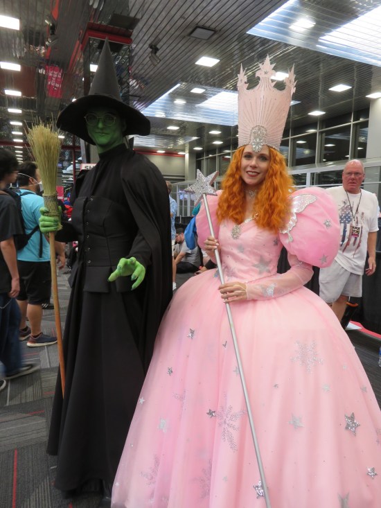 Cosplayers as the actual Wicked Witch of the West and Glinda the Good Witch from the classic "Wizard of Oz" movie.
