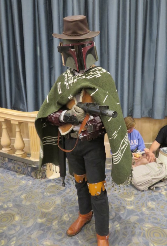 Boba Fett cosplayer with Clint Eastwood hat, pants and blanket.