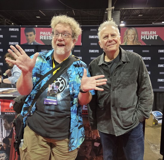 Me doing jazz hands while Paul Reiser has his hands in his pockets, doing the straight-man role exactly right.