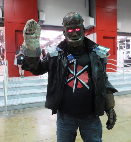 Robotman cosplayer with light-up eyes and Dead Kennedys T-shirt.