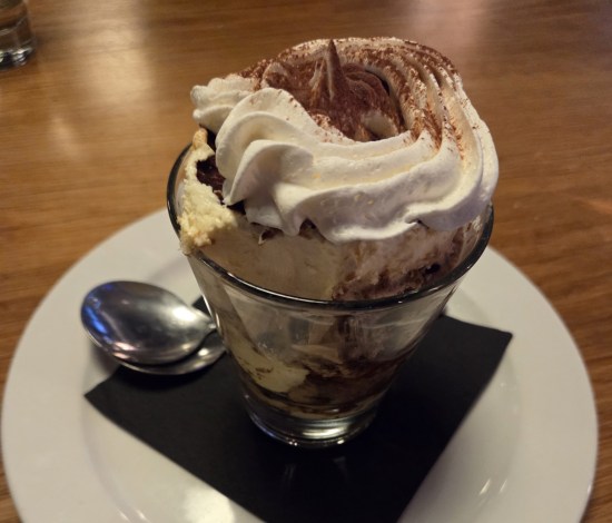 tiramisu served in a sundae glass instead of as a cake slice.