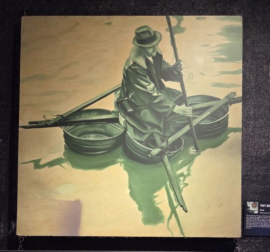 Green-on-yellow old-timey pic of a guy in a trenchcoat floating in a rigged watercraft made of four metal washbasins and four wooden slats.