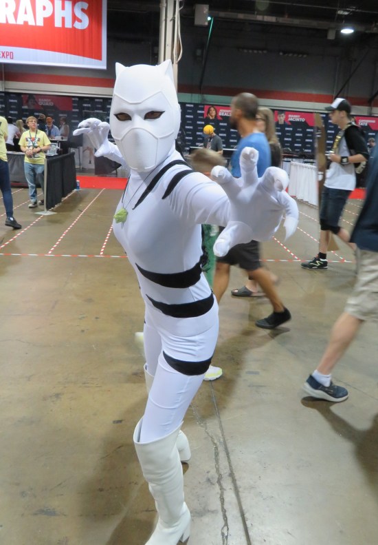 White Tiger costume with green magic amulet, poised to strike.