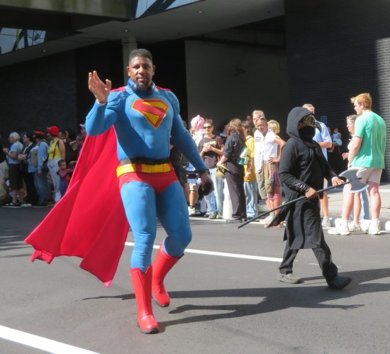 Superman played by a Black fan, waving to us.