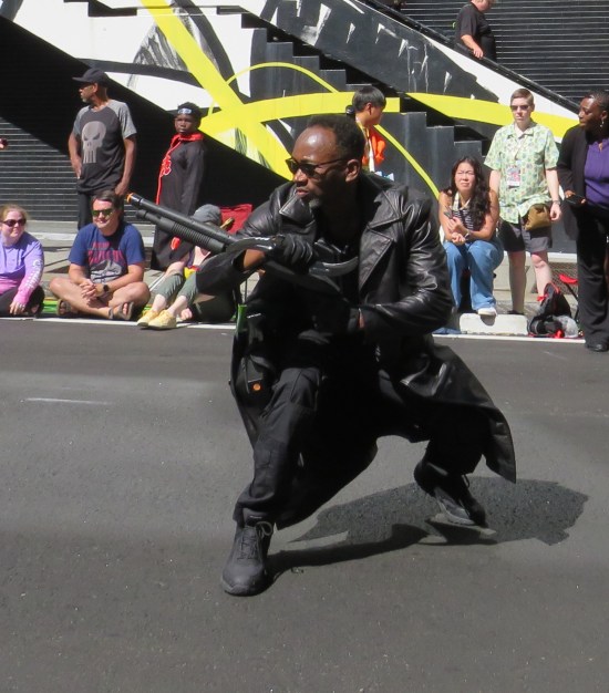 Blade costume, crouched and ready to shoot to his right.