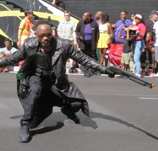 Blade cosplayer crouched right in front of us, fake rifle outstretched to his left.