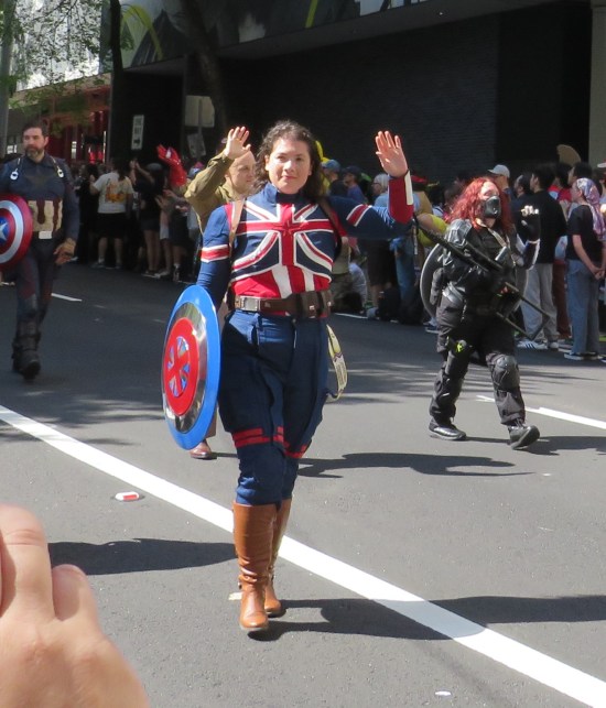 Captain Carter cosplayer as seen in "What If...", but waving.
