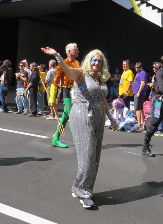 Dazzler costume, waving hi.