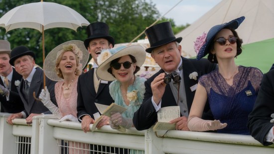The "upstairs" cast of "Downton Abbey" at a racetrack watching horses run offscnree, or perhaps something more interesting.