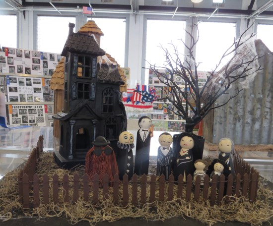 Addams Family figurines carved in the Fisher Price style.