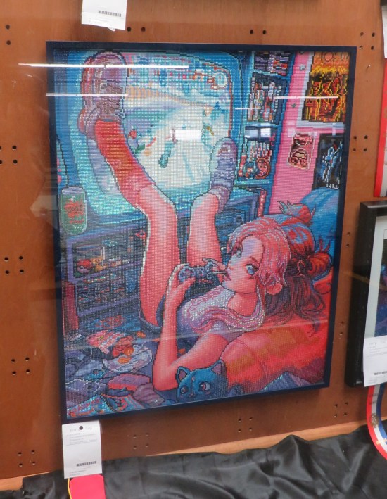 Painting of a young lady playing video games on a large flatscreen TV, lying on the floor with her legs propped up on the screen, which you'd think would interfere with her gameplay.