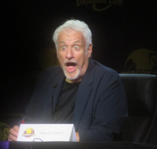 John de Lancie with shocked expression.