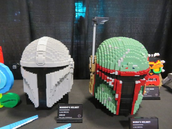 Lego life-size heads of The Mandalorian and Boba Fett.