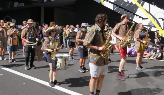 marching band wearing tops using the famously hideous Marriott Marquis carpet pattern.