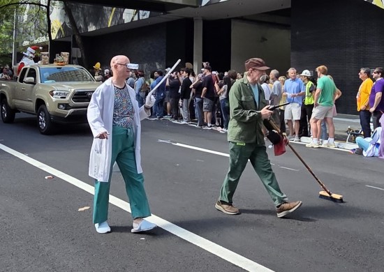 Professor Farnsworth with extra-long index finger and Scruffy with broom.