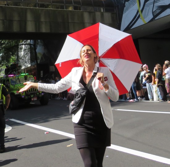 Resident Evil scientist with Umbrella Corporation umbrella and carefree attitude.