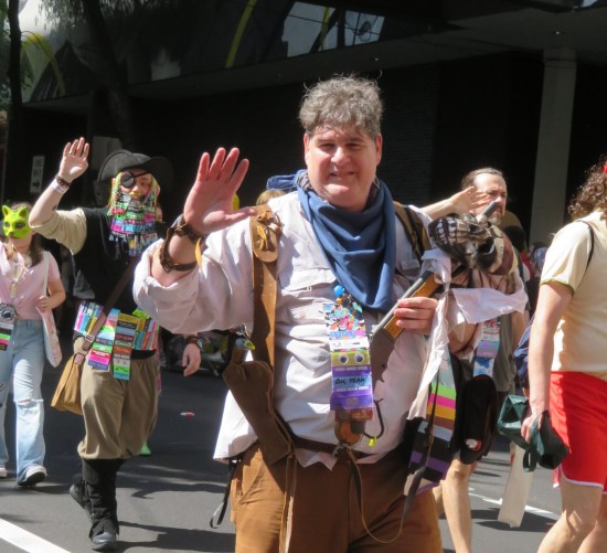 Rick O'Connell cosplayer with old-timey sawed-off shotgun with an undead skull on the barrel.