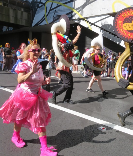 Princess cosplayer and two marchers on white tubas