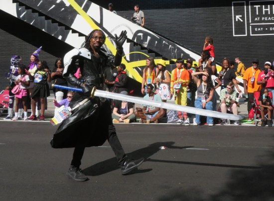 Sephiroth cosplayer with Masamune sword, waiving hi at us.