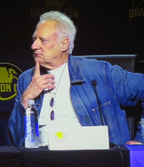 Dragon Con 2025Brent Spiner seated on stage, thinking hard.