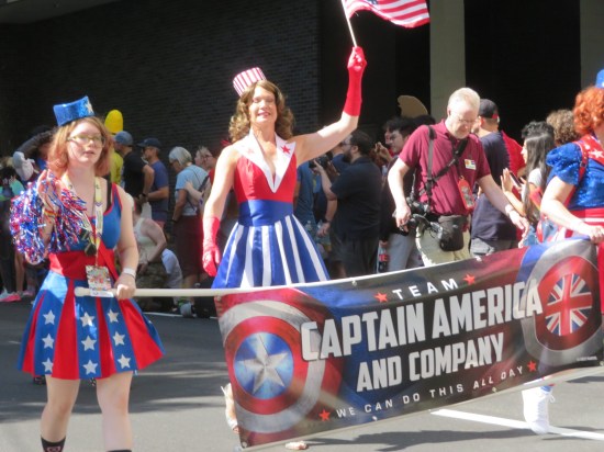 Team Captain America group with their banner held by USO dancers from "The First Avenger".