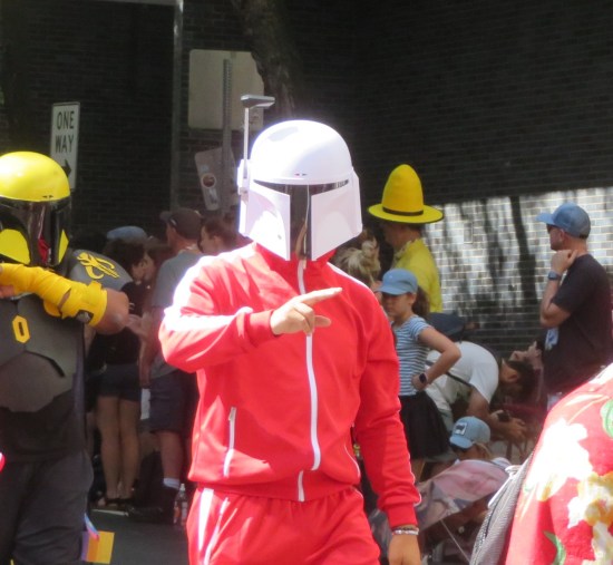 Guy in red tracksuit and Boba Fett helmet.
