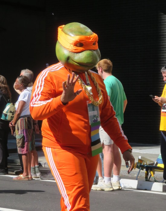 Orange tracksuit and Michelangelo mask.